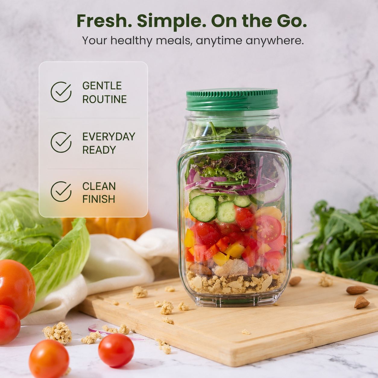 Portable salad jar with green twist lid filled with fresh mixed salad on a marble counter
